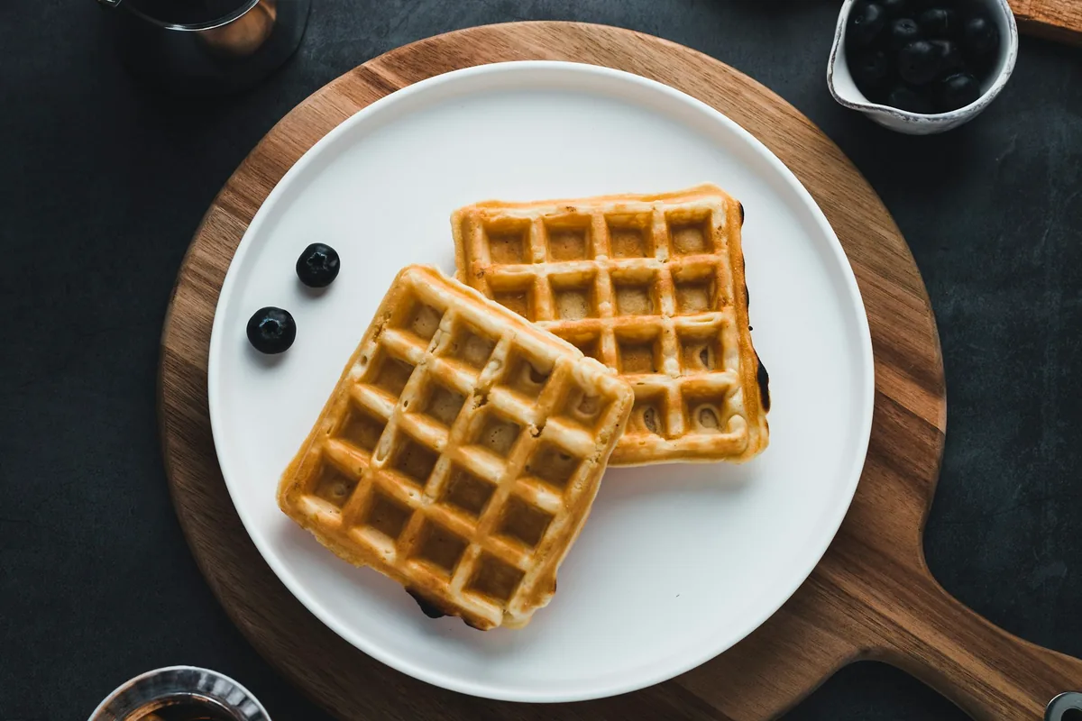 Two rectangular, evenly gridded waffles on a white plate