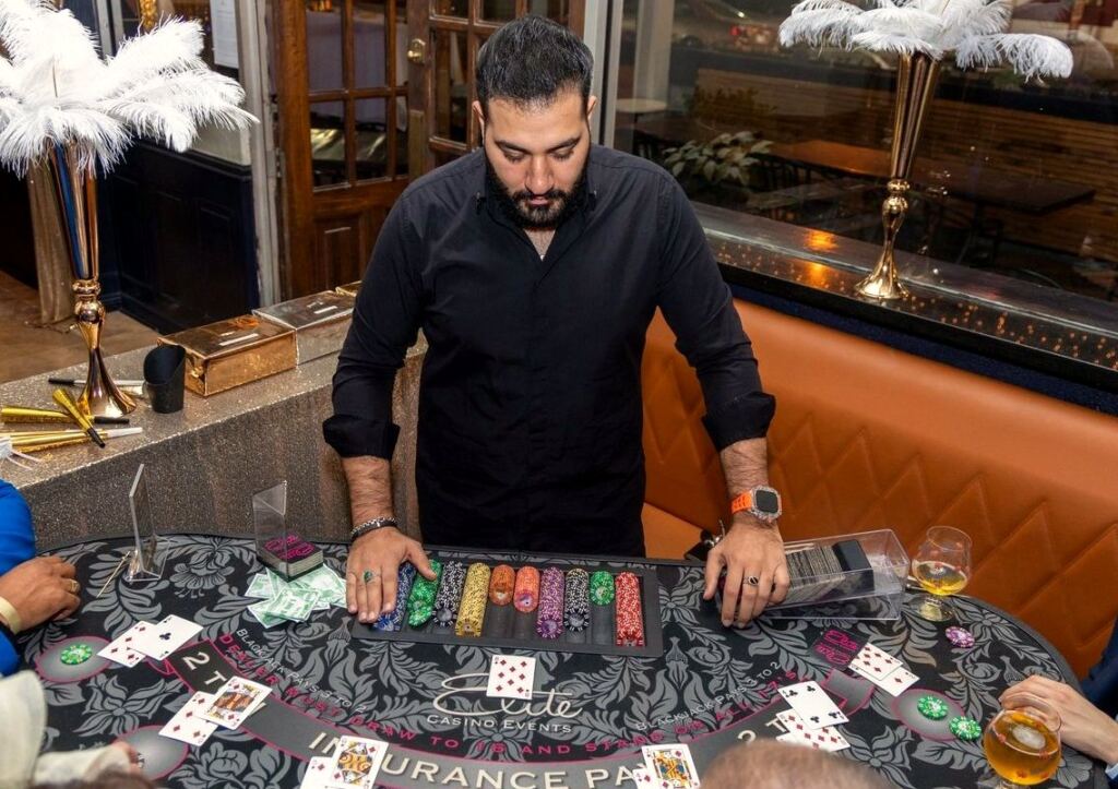 A dealer at the blackjack table during the New Year's Eve casino night at Meyboom Brasserie