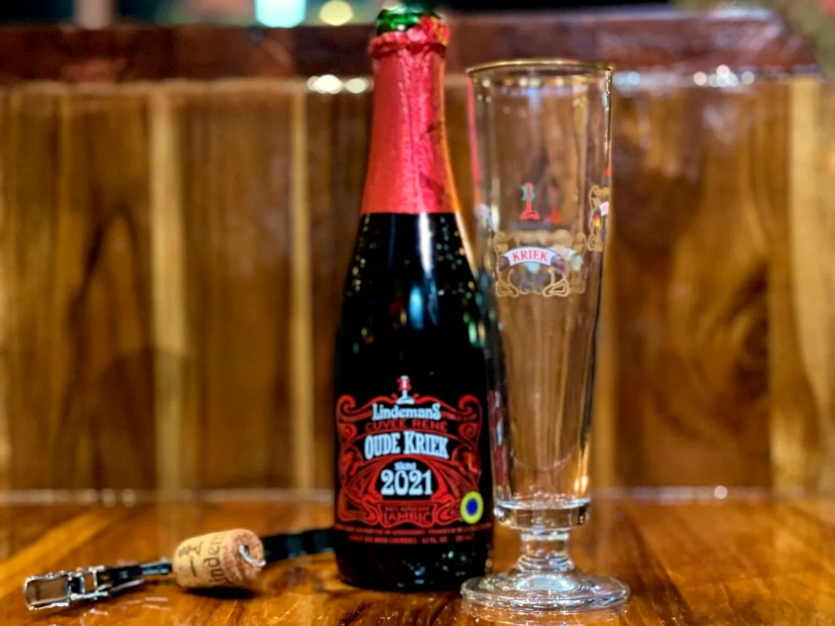 A bottle of Lindemans Oude Kriek beside a tall flute on the bar at Meyboom Brasserie