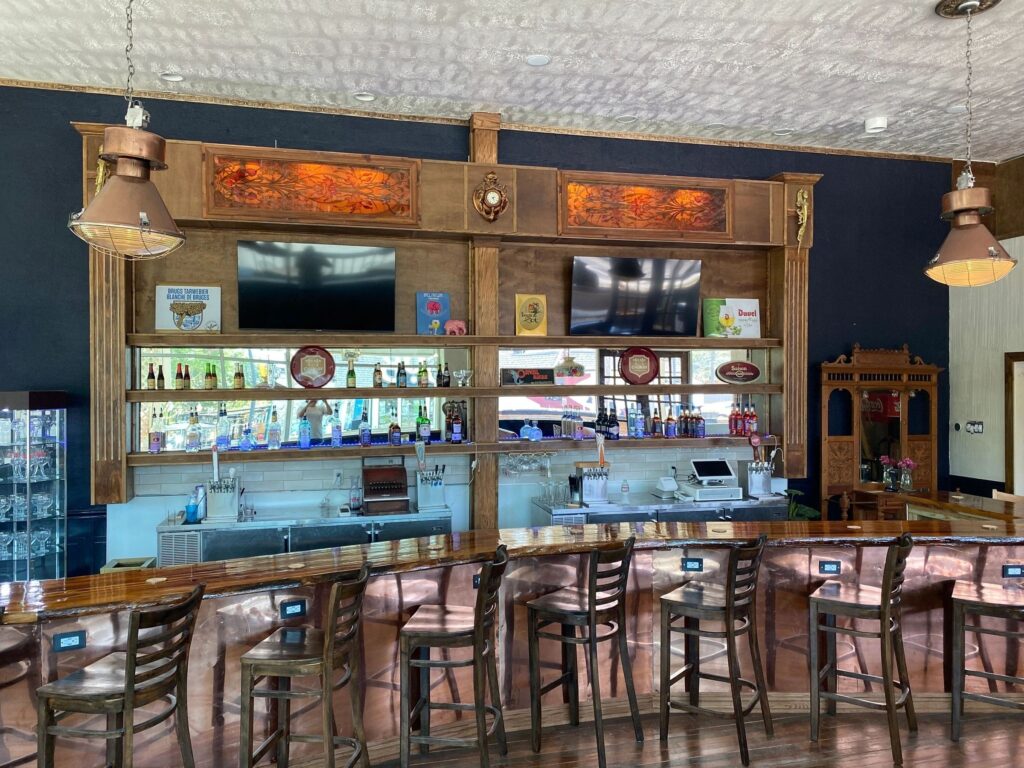 The main bar at Meyboom Brasserie, bottles lining the back shelves above the taps