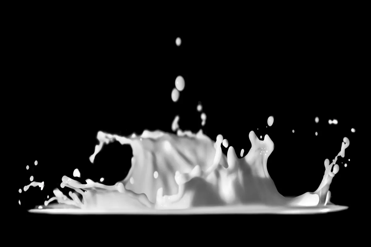 White liquid splashing against a black background