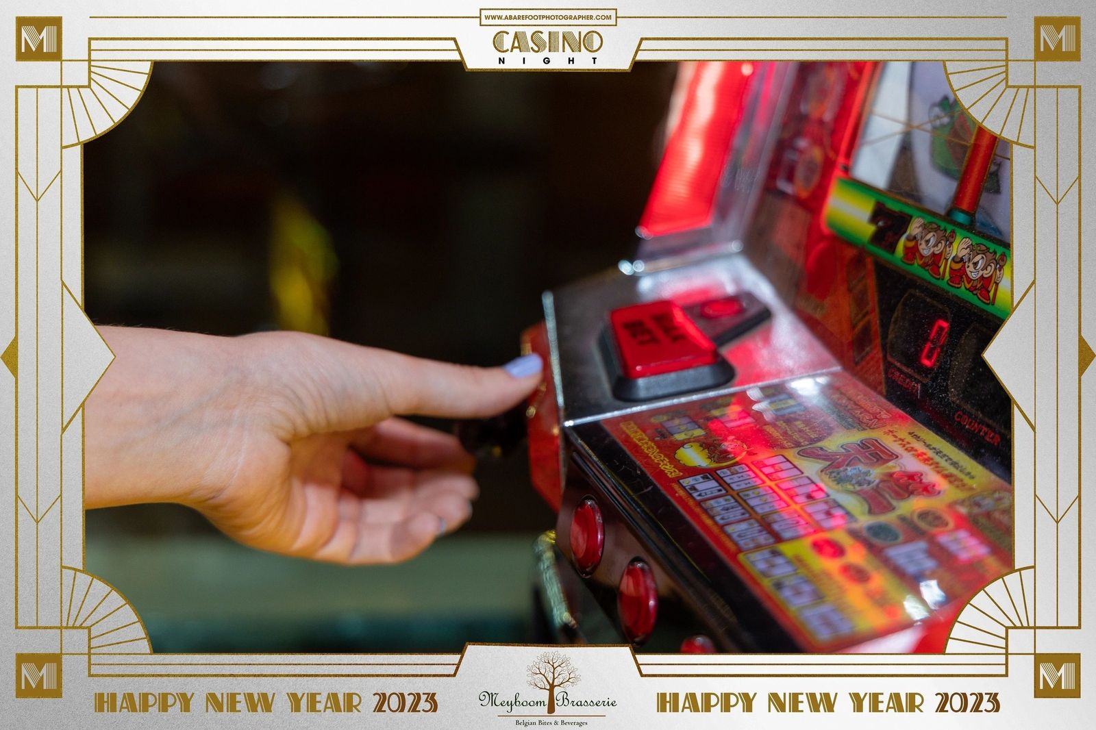 A guest playing a slot machine during the New Year's Eve 2023 casino night at Meyboom Brasserie