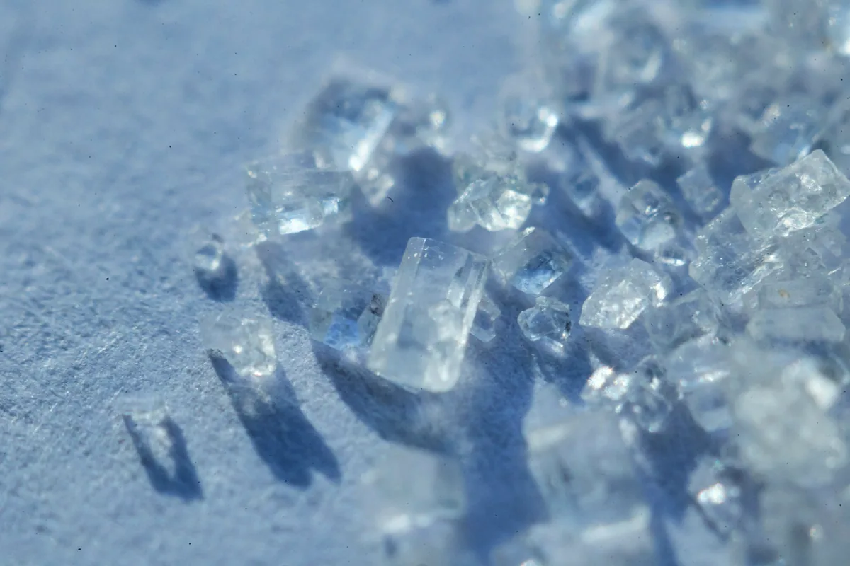 A macro photograph of coarse sugar crystals