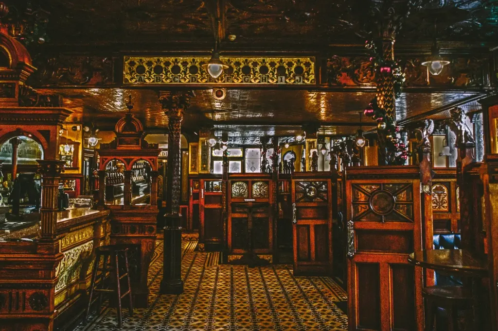The carved wooden interior of the Victorian Crown Bar in Belfast