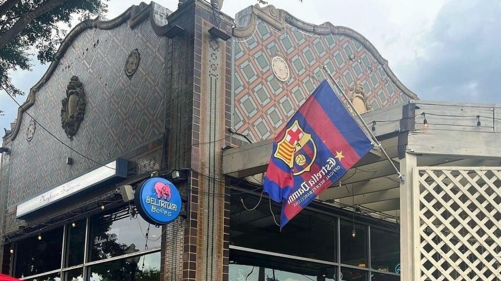The Meyboom Brasserie building on Greenville Avenue, with its tiled Mission-style parapet, the Meyboom Brasserie sign and a Delirium Beers neon